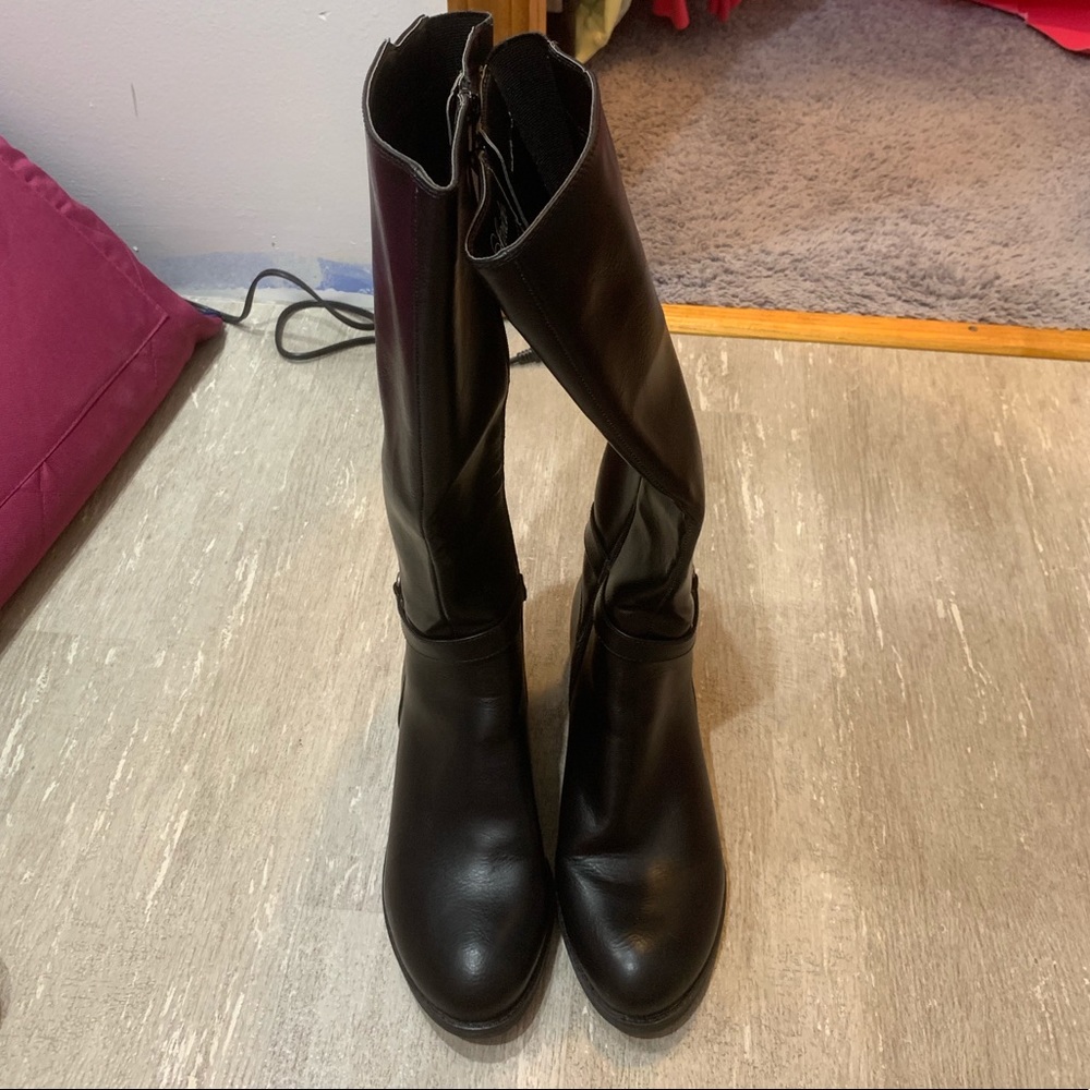 Knee high zip boots with a little heel.